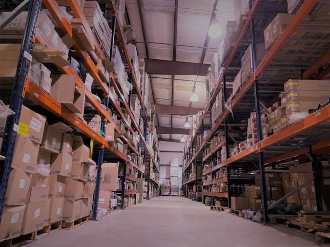 INterior of plumbing warehouse with chelves stocked with plumbing supplies